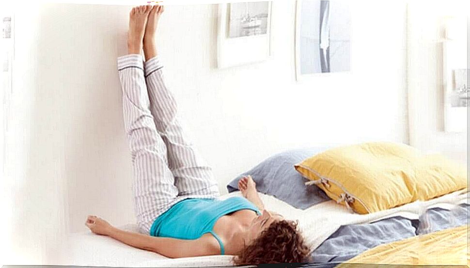 feet up against the wall to help get rid of lower back pain