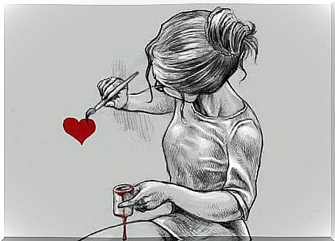 The girl paints a heart