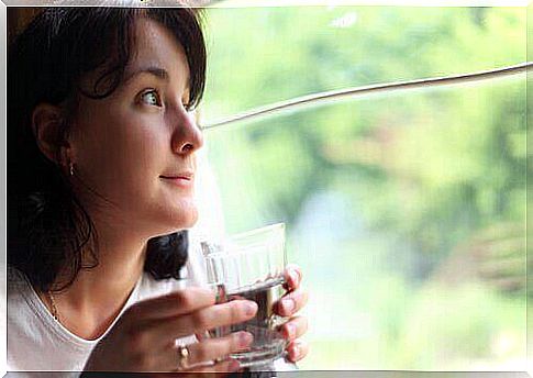 woman drinking hot water