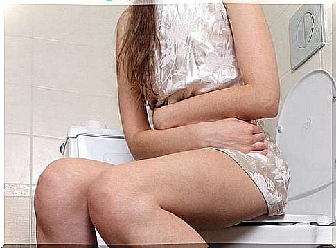 girl sitting in the toilet