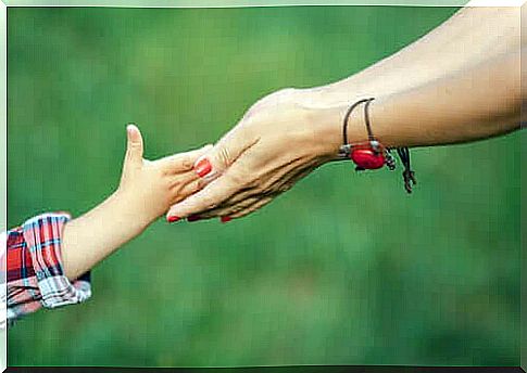 Hands of mother and daughter